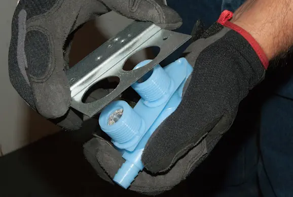 PHOTO: Install the mounting bracket on the new inlet valve.