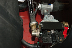 Unscrew the pressure switch tube fitting.