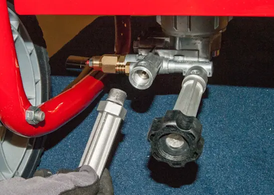 PHOTO: Reinstall the high-pressure outlet fitting.