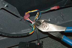 PHOTO: Cut the wire harness retainer.