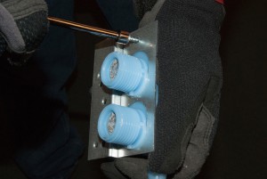 PHOTO: Install the inlet valve bracket screws.