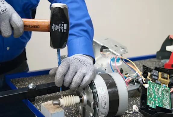 PHOTO: Remove the worm gear roll pin.