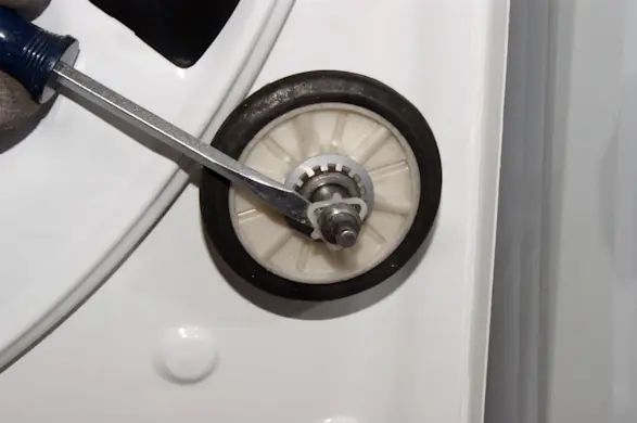 PHOTO: Pry the triangular washer loose.