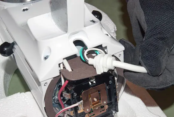 PHOTO: Reinstall the power cord.