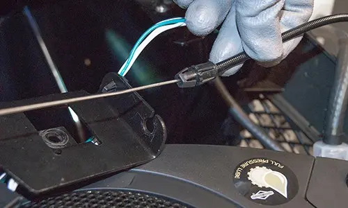 PHOTO: Install the cable on the lever bracket.