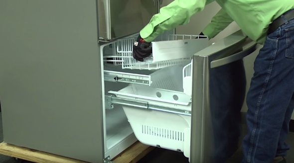 PHOTO: Reinstall the freezer shelf.