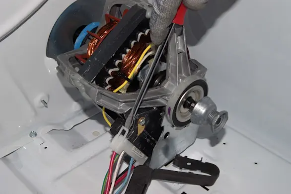 PHOTO: Release the motor harness locking tab.