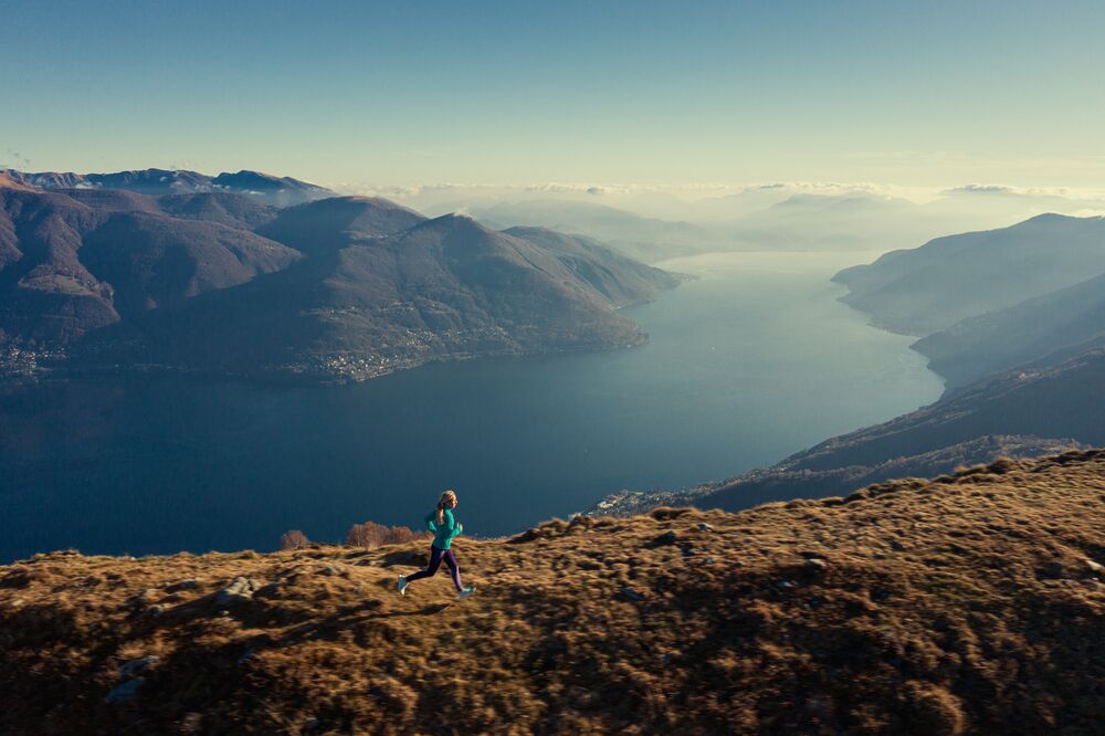 Running overlooking a fjord