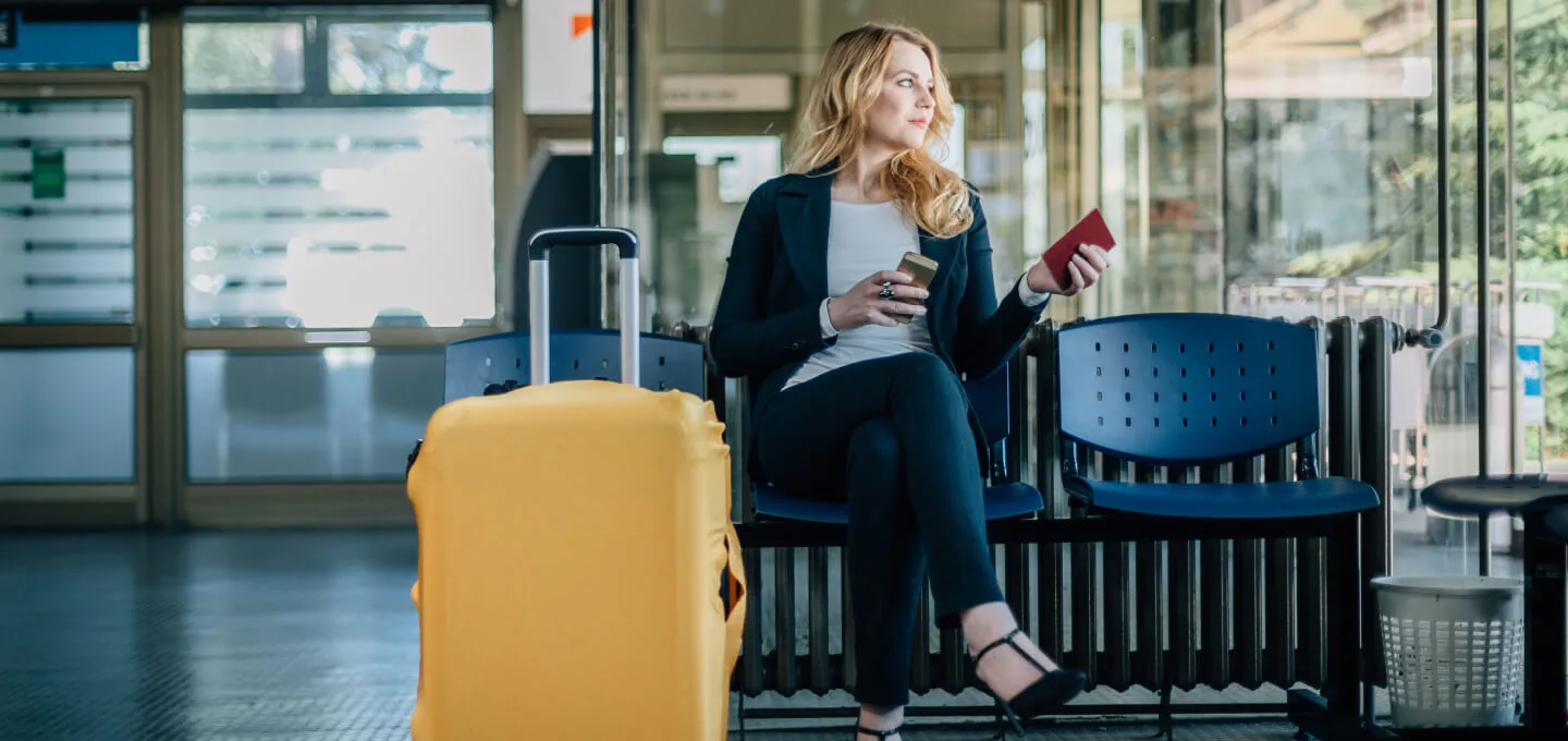 Woman travelling with a phone in her hand