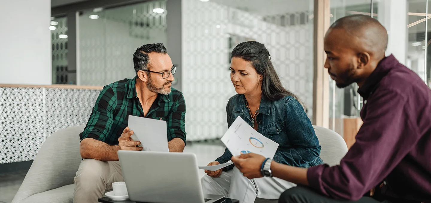 3 people working in a office