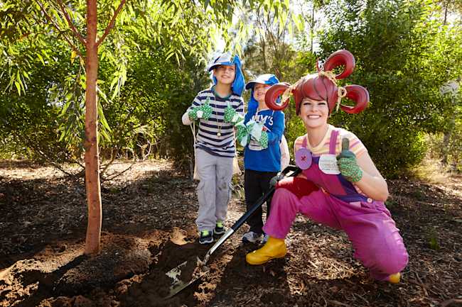 dirtgirl helping children plant a tree at a National Tree Day event in 2014