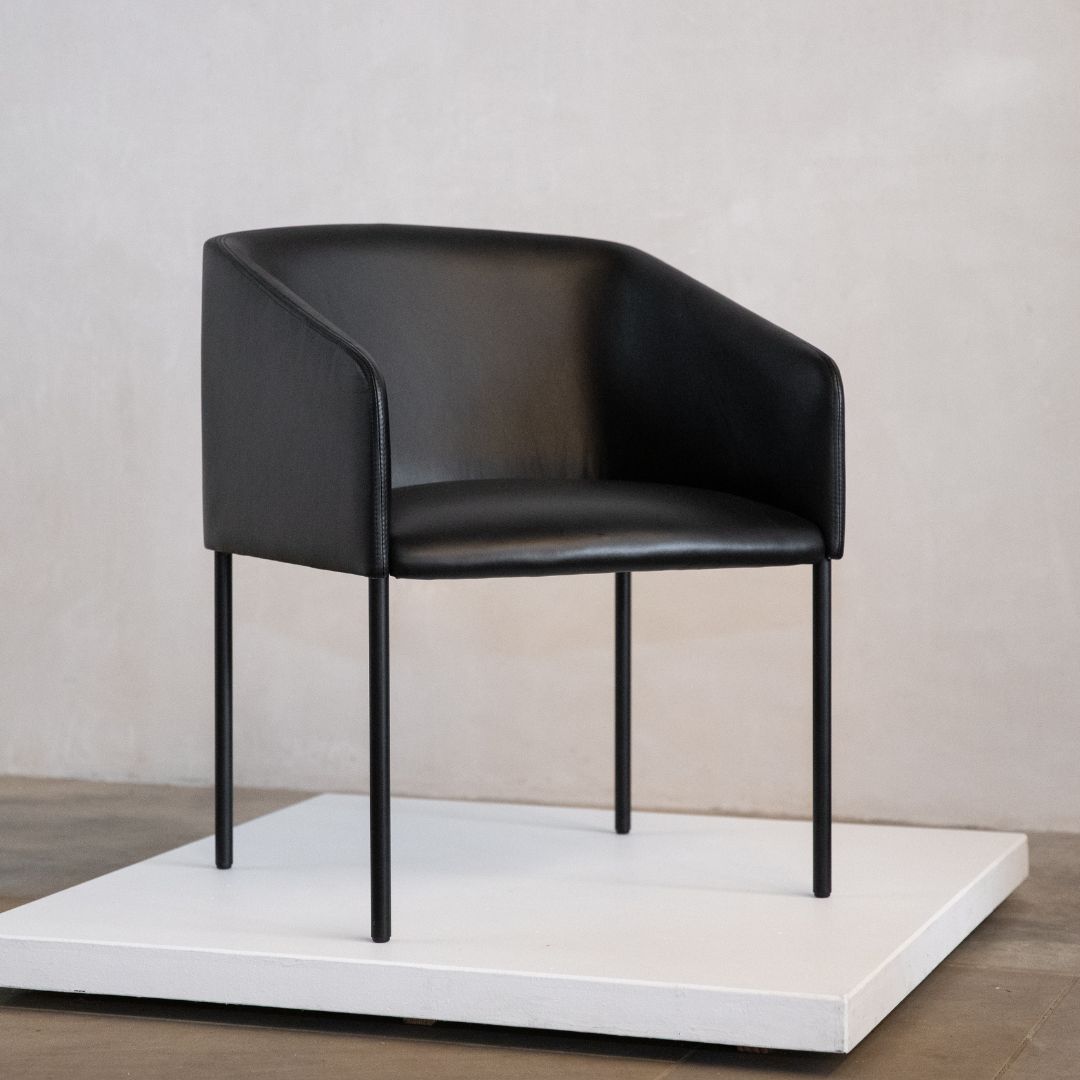 A black chair with black steel legs