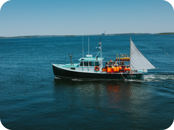 An image of a lobster boat headed out to fish.