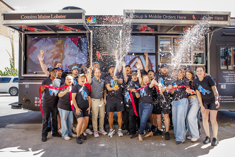 Champagne is sprayed as our Kentucky Family celebrates the trucks grand opening 