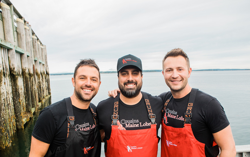 A photo of our Miami franchisee with Cousins Maine Lobster founders Jim & Sabin in Maine