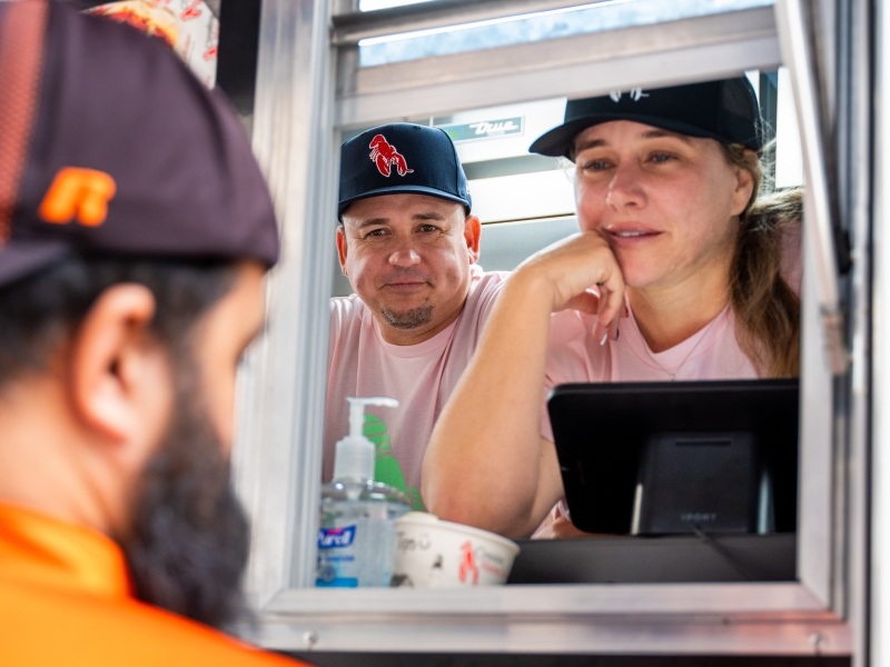 Mandy & Damon, our local Jacksonville Family take a customer's order at their Grand Opening!