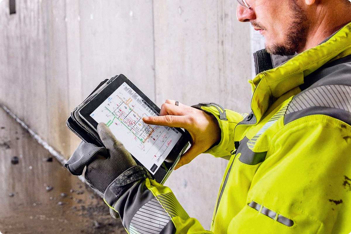 Fieldwire is being shown on an iPad in the field. A field engineer is using the Fieldwire application to see and markup their plans while at the construction site. 