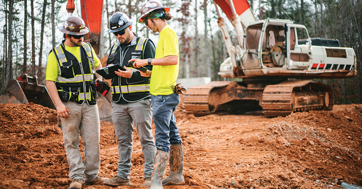 Construction workers use Fieldwire on a tablet to get information on the field.