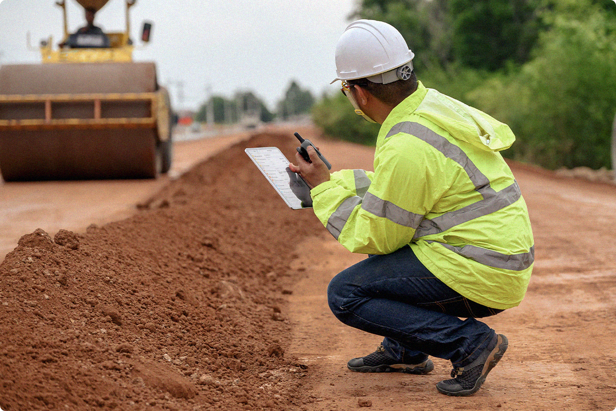 Construction workers use Fieldwire on a tablet to get information on the field.