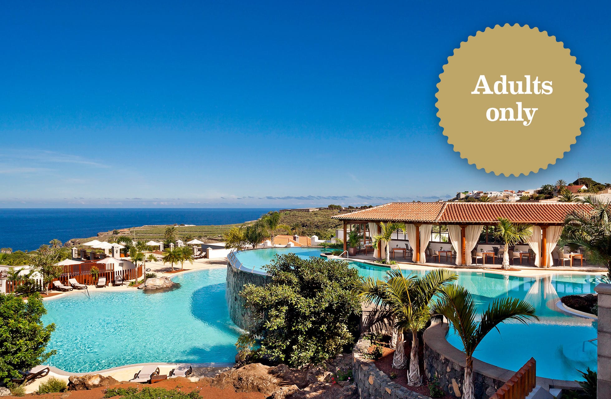 hotellområde med infinitybasseng på meliá hacienda del conde med havutsikt, palmer og bygninger i solrikt kystlandskap, med merking adults only