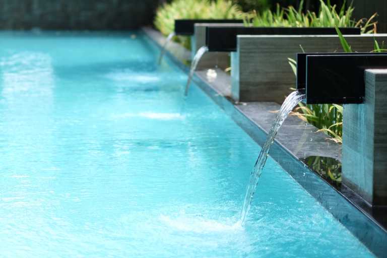 Image of pool up close with fountains flowing - blog asset