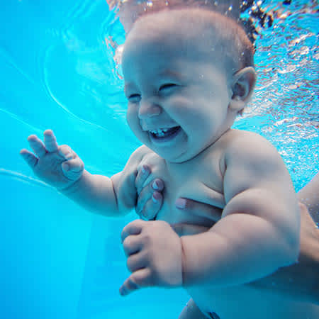 Ozone Swim baby held underwater