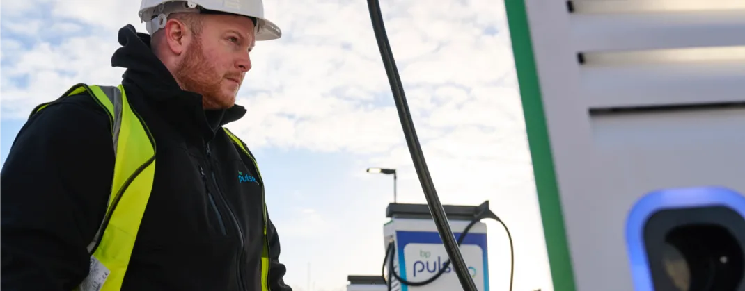 A bp pulse worker carrying out maintenance checks on a bp pulse charger. 