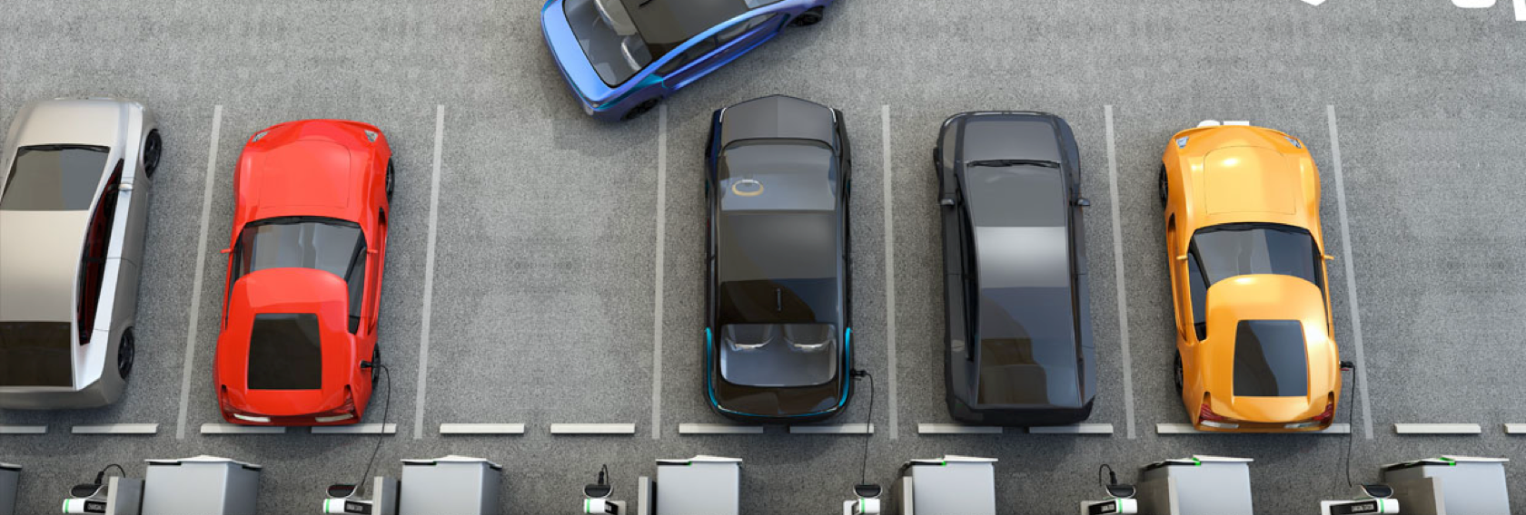 A birdseye view of five Electric Vehicles parked adjacently in charging bays at a fast charging hub. A sixth blue Electric vehicle can be seen driving out of the third charging bay from the left.