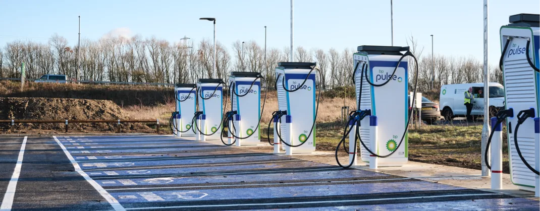A row of available bp pulse ev chargers on a sunny day. 