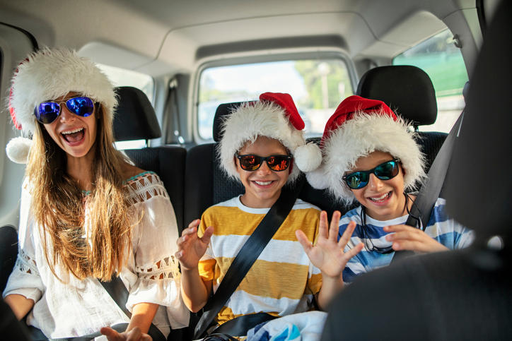 Kid's travelling via car, wearing sunglasses and cap