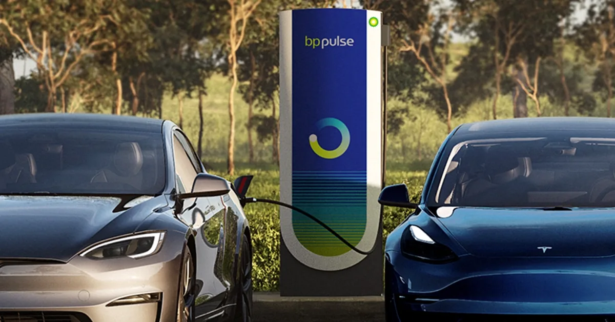 Two Tesla Model 3's are being charged by a bp pulse charger.