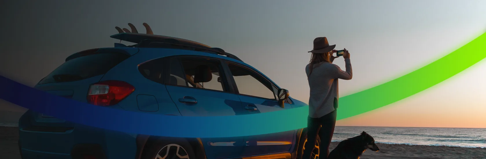 Person with a dog photographing a beach sunset next to a blue car with surfboards on the roof, framed by a flowing blue-green gradient symbolizing energy.