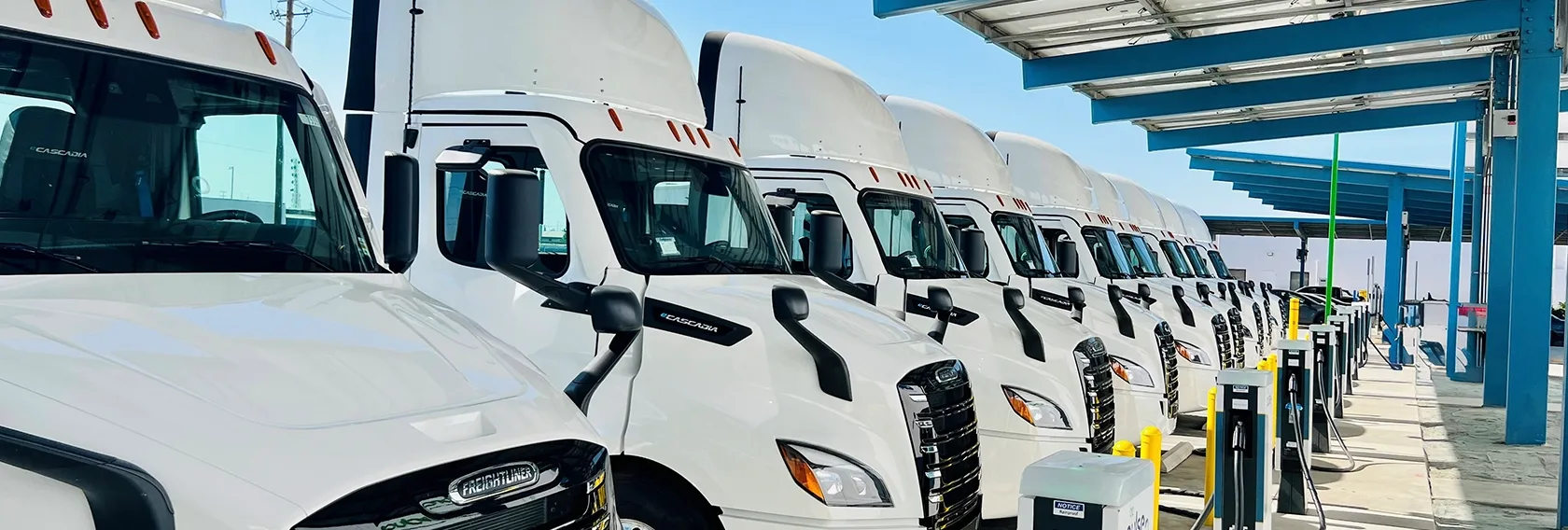 A long queue of trucks is getting charged simultaneously at the charging station, thanks to the ample number of charging ports that keep them powered without delay.