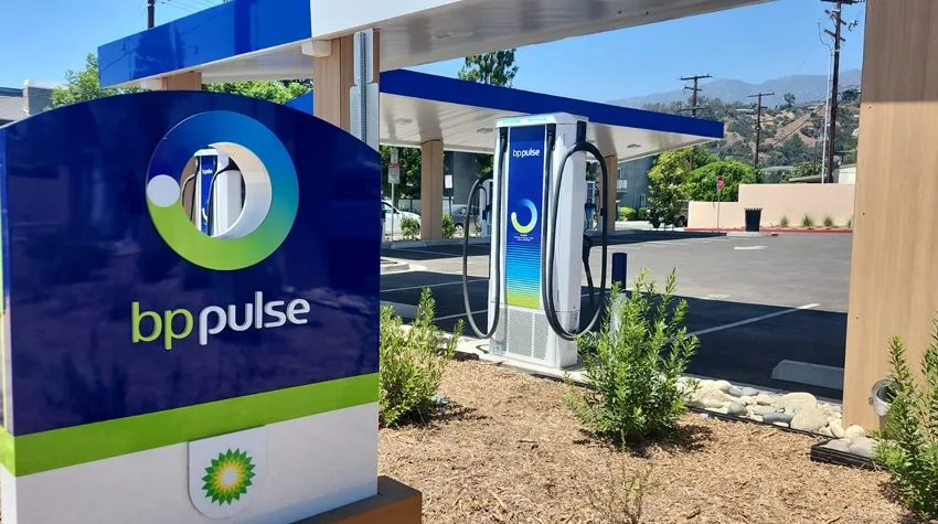 bp pulse EV charging station with branded canopy and charger in scenic outdoor setting