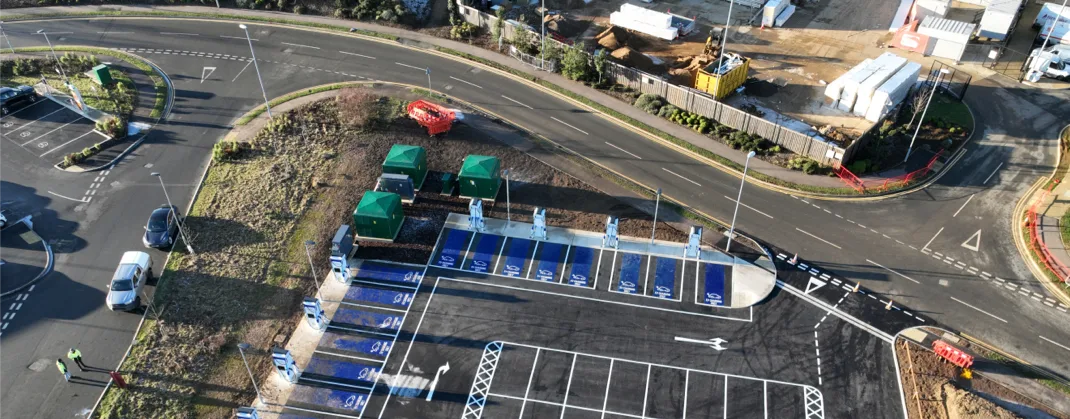 Numerous parking spaces for EVS, all standing empty.