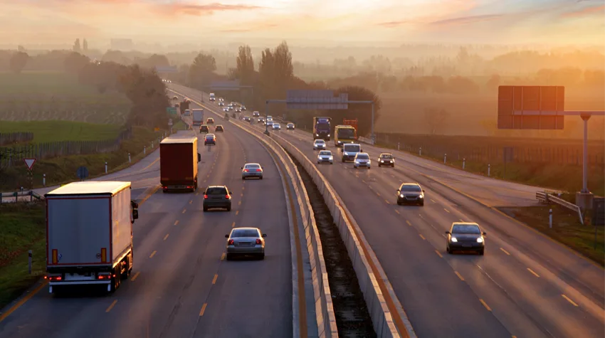 Cars driving along the motorway in twilight. 