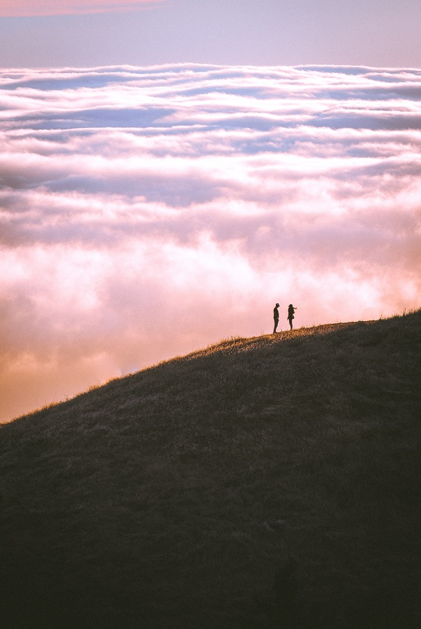 two persons on hill