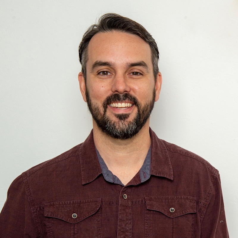 A portrait photo of TJ, the practitioner and licensed acupuncturist