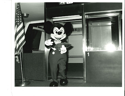 Mickey Mouse stands at the door of Train 1 during opening-day festivities at Houston Intercontinental Airport on Aug. 17, 1981. Mickey helped cut the ribbon for the new WEDway PeopleMover. 