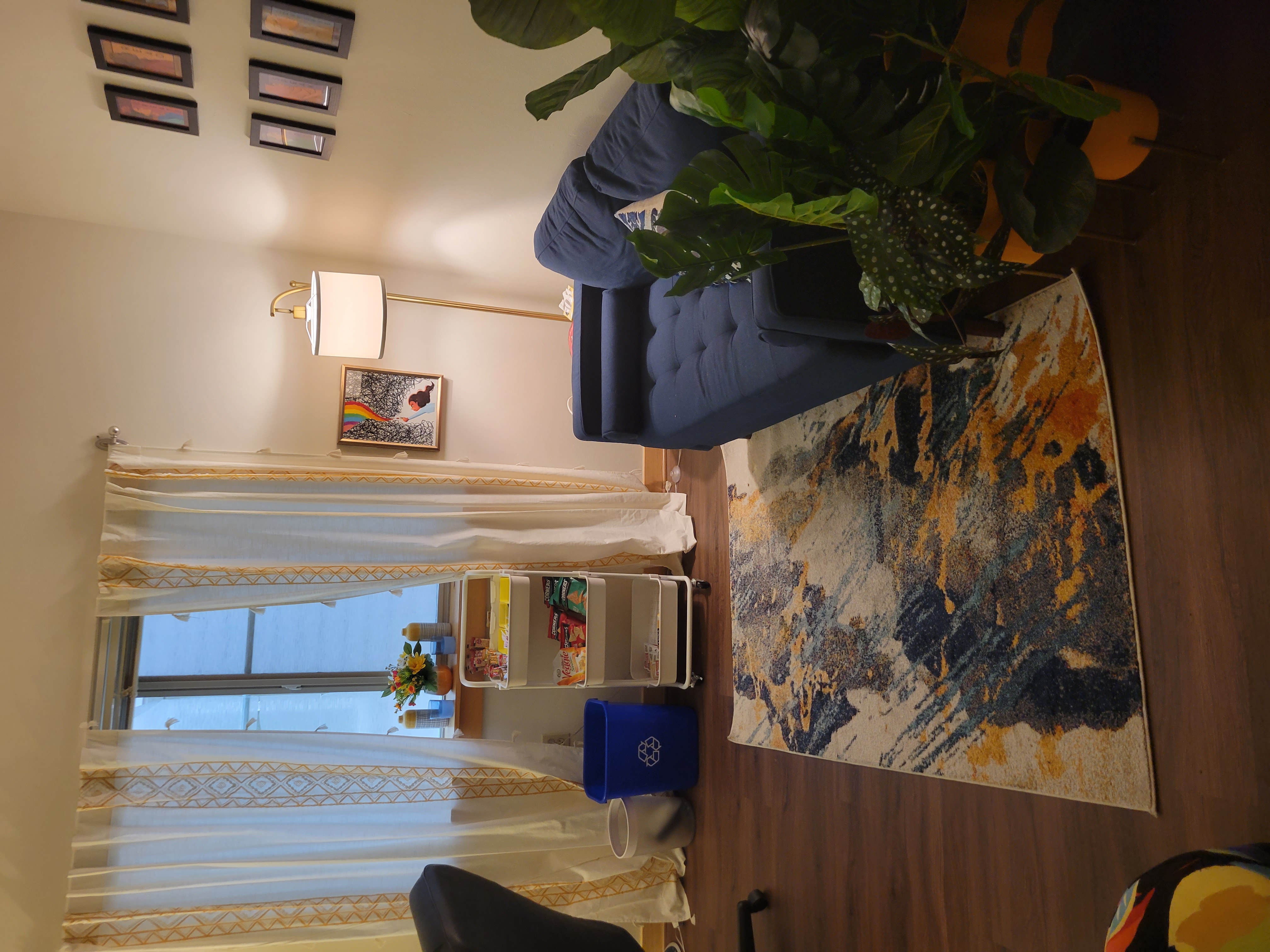 My waiting room with a couch and snack amenities. 