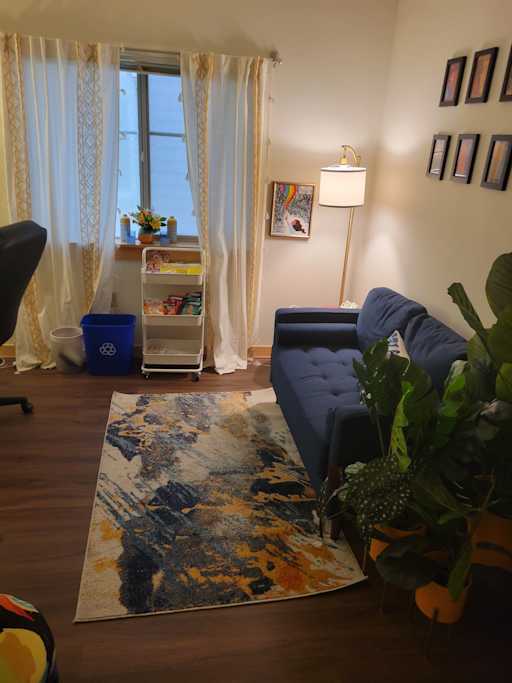 My waiting room with a couch and snack amenities.