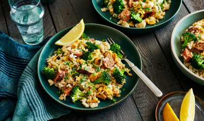 Plates of sausage and broccoli fried rice
