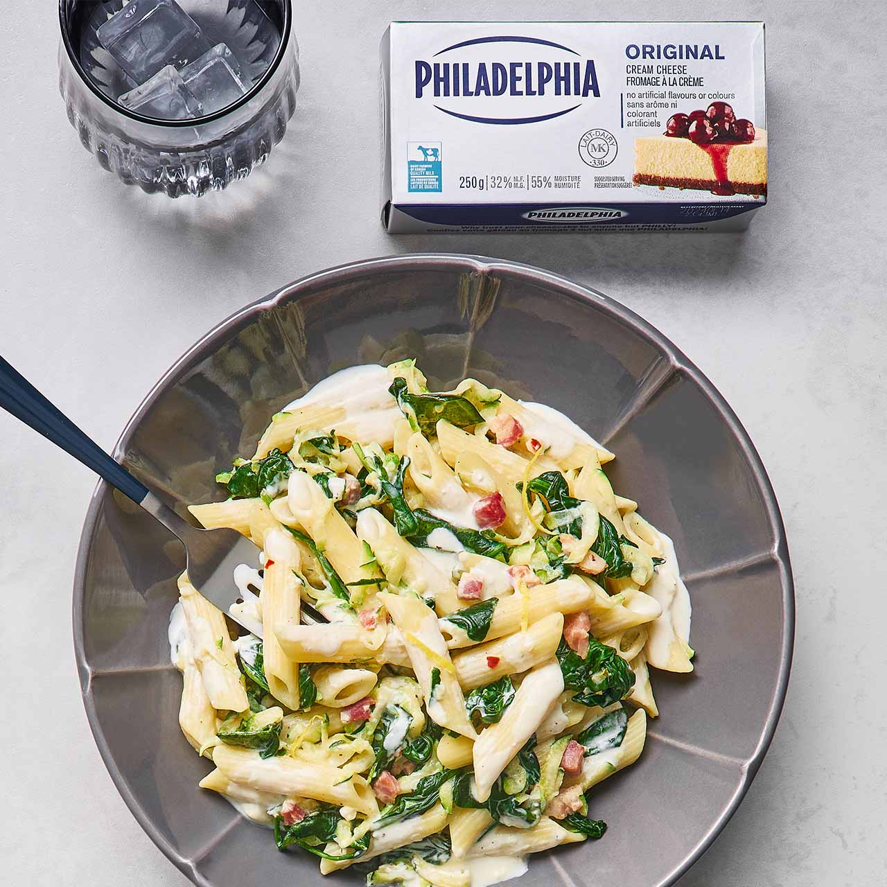 Image of a plate of zucchini and spinach penne with creamy lemon sauce