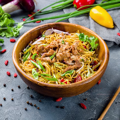 A bowl of Sesame Chicken and Noodle Stir-Fry