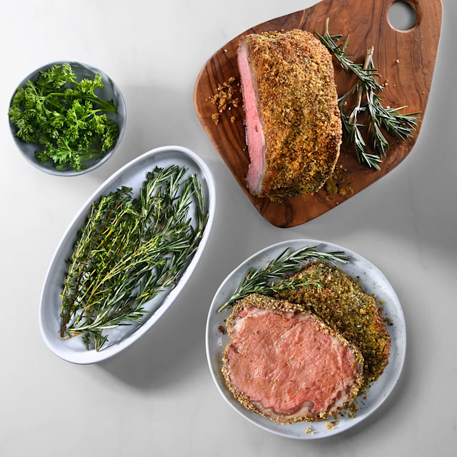 plates with Dijon and Herb Crusted Striploin Roast