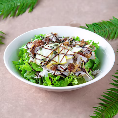 A single serve bowl of balsamic chicken salad