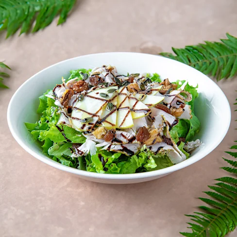 A single serve bowl of balsamic chicken salad