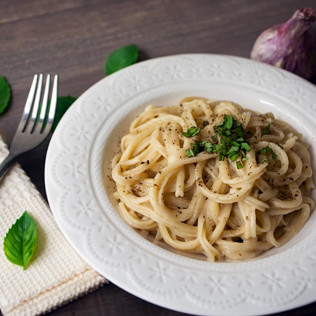 A plate of vegan alfredo sauce pasta