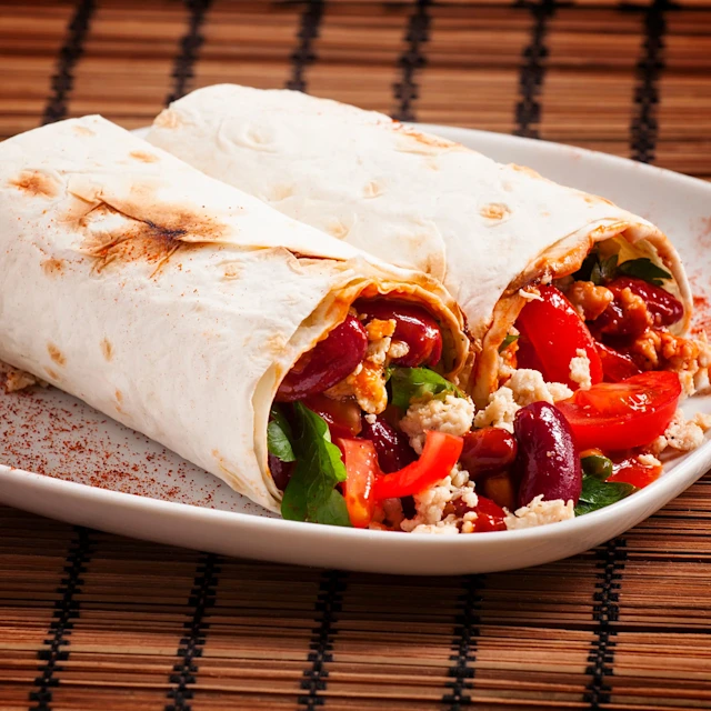 A plate of lime and mixed bean fajitas