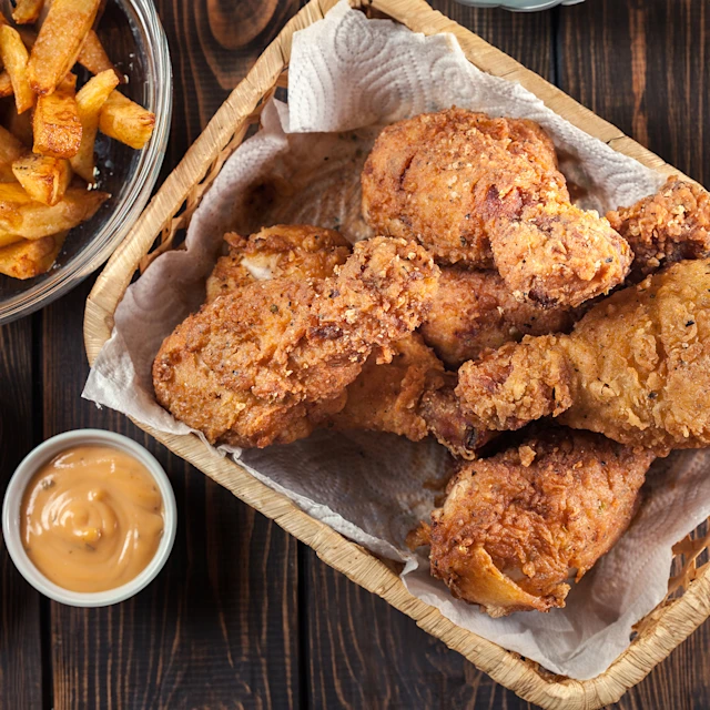 Cooked Air Fryer Chicken Drumsticks in a basket.